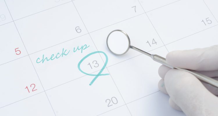 A note of a dentist check up on calendar