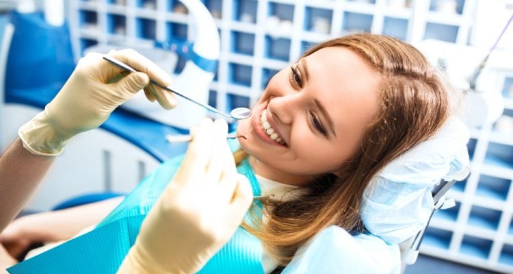 Women smiling before the dentist performs the dental procedure