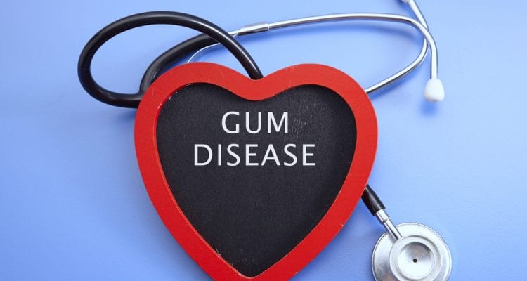 Stethoscope and red love with medical conceptual text-gum disease