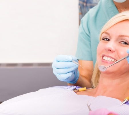 Close up woman sitting on a dental chair